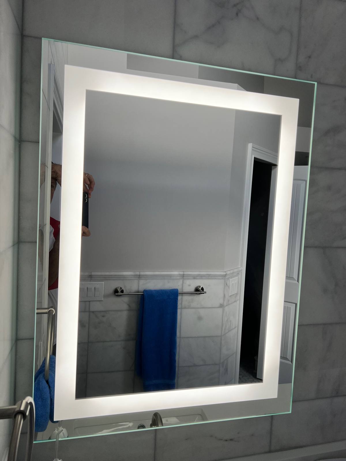 Round backlit mirrors over double vanity