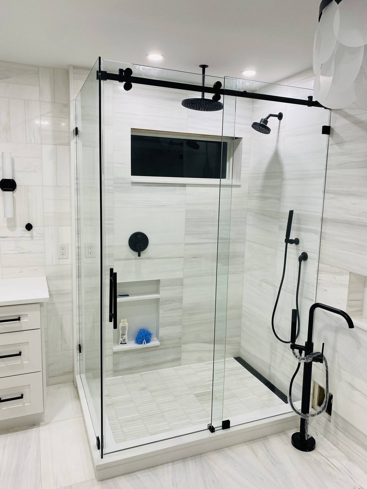 Glass shower with marble surround