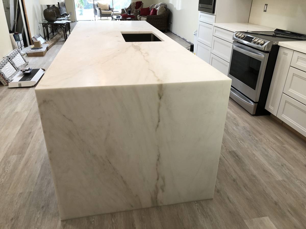 White kitchen with waterfall-edge island