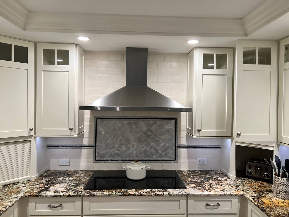 Kitchen with hexagon marble backsplash