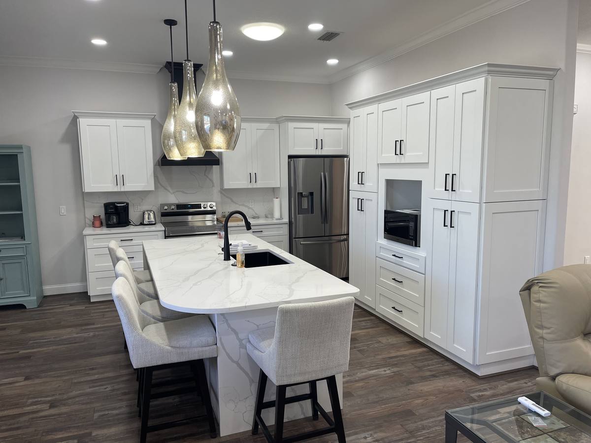 Kitchen island with gold pendant lighting
